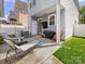 Backyard patio with outdoor seating, grill, and partial shade, offering a comfortable space for entertaining at 6909 Dunton St, Huntersville, NC 28078