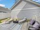 Backyard patio area featuring comfortable seating and lounge chairs, perfect for outdoor relaxation and entertaining at 6909 Dunton St, Huntersville, NC 28078