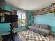 Bedroom with Peloton bike, sofa, and large window at 6909 Dunton St, Huntersville, NC 28078