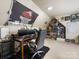 Bright bedroom offers a dedicated workspace and ample shelving for collectibles, blending functionality with personal style at 6909 Dunton St, Huntersville, NC 28078
