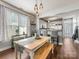 Cozy dining area with natural light, bench seating, and a view into the kitchen at 6909 Dunton St, Huntersville, NC 28078