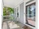 Relaxing front porch with rocking chairs, a view, and a welcome mat at 6909 Dunton St, Huntersville, NC 28078