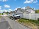 Detached garage with a white truck parked in front, offering convenient parking and storage space at 6909 Dunton St, Huntersville, NC 28078