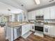 Bright kitchen featuring white cabinets, stainless steel appliances, and a convenient layout perfect for cooking and entertaining at 6909 Dunton St, Huntersville, NC 28078