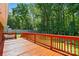 Stunning deck overlooking the property with lush greenery, offering ample space at 707 Hester Dr, Dallas, NC 28034
