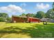 Expansive backyard perfect for entertaining with lush greenery and mature trees at 707 Hester Dr, Dallas, NC 28034
