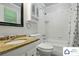 Bathroom featuring a granite countertop, white cabinets, a tub, and white tile walls at 707 Hester Dr, Dallas, NC 28034