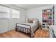 Bright bedroom with a cozy bed, bookshelf, and natural light from large windows at 707 Hester Dr, Dallas, NC 28034