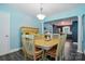 Charming dining room featuring a square table with seating for six and a stylish light fixture at 707 Hester Dr, Dallas, NC 28034