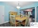 Charming dining area with a square table and decorative columns near kitchen at 707 Hester Dr, Dallas, NC 28034