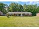 Inviting brick home with well-manicured lawn and landscaping offering great curb appeal at 707 Hester Dr, Dallas, NC 28034