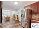 Open kitchen layout adjacent to the dining area, featuring stainless steel appliances at 707 Hester Dr, Dallas, NC 28034
