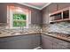 Modern kitchen details including a granite countertop and stainless-steel appliances at 707 Hester Dr, Dallas, NC 28034