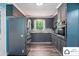 Modern kitchen with gray cabinets, stainless steel appliances, and mosaic tile backsplash at 707 Hester Dr, Dallas, NC 28034