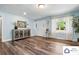 Bright and airy living room with wood floors, light blue walls, and stylish decor at 707 Hester Dr, Dallas, NC 28034