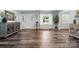 Bright living room with wood floors, updated decor, and lots of natural light at 707 Hester Dr, Dallas, NC 28034