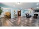 Spacious living room with hardwood floors, fireplace, and an open floor plan to the dining area at 707 Hester Dr, Dallas, NC 28034