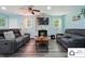 Beautiful living room featuring gray wood flooring, fireplace, and contemporary furniture at 707 Hester Dr, Dallas, NC 28034
