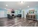 Bright and spacious living area with wood floors, fireplace, and modern furniture at 707 Hester Dr, Dallas, NC 28034