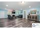 Spacious living room featuring fireplace, modern furniture, and stylish wood floors at 707 Hester Dr, Dallas, NC 28034