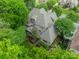Beautiful aerial view of a home, showcasing its roof, backyard, and mature tree coverage at 7138 Wessynton Dr, Charlotte, NC 28226