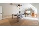 Game room featuring a pool table, ping pong table, neutral carpet, and ceiling fan at 7138 Wessynton Dr, Charlotte, NC 28226