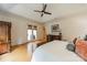 Bright main bedroom features French doors to the backyard and elegant furnishings at 7138 Wessynton Dr, Charlotte, NC 28226
