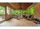 Inviting screened porch with comfortable seating and views of the surrounding greenery at 7138 Wessynton Dr, Charlotte, NC 28226