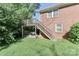 A spacious backyard with deck, stairs, and car port at 805 Waverly Pl # 16, Statesville, NC 28677