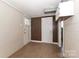Basement with painted brick and wood paneling and multiple doors at 805 Waverly Pl # 16, Statesville, NC 28677