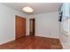 Bedroom featuring hardwood floors, neutral walls, and closet at 805 Waverly Pl # 16, Statesville, NC 28677