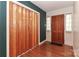 Entryway featuring hardwood floors, a wooden closet door, and a wooden front door with sidelights at 805 Waverly Pl # 16, Statesville, NC 28677