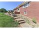Brick house with a terraced front yard and a walkway leading to the entrance at 805 Waverly Pl # 16, Statesville, NC 28677