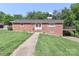 Charming brick home with a well-manicured lawn, walkway, and covered parking on a sunny day at 805 Waverly Pl # 16, Statesville, NC 28677