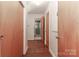 Hallway with wood doors leading to bathroom and bedrooms at 805 Waverly Pl # 16, Statesville, NC 28677