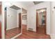 Hallway featuring hardwood floors and doorway with views into other rooms at 805 Waverly Pl # 16, Statesville, NC 28677