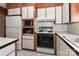 Bright kitchen with white appliances and light-colored countertops at 805 Waverly Pl # 16, Statesville, NC 28677