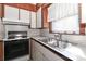 Well-lit kitchen with stainless steel sink and appliances, with tile flooring at 805 Waverly Pl # 16, Statesville, NC 28677