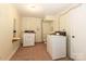 The laundry room has a utility sink, washer, and dryer hookups at 805 Waverly Pl # 16, Statesville, NC 28677