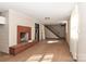 The living room features a brick fireplace and easy access to the staircase at 805 Waverly Pl # 16, Statesville, NC 28677