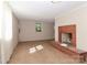 Spacious living room features a brick fireplace and neutral paint colors at 805 Waverly Pl # 16, Statesville, NC 28677