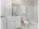Well-lit bathroom with a white vanity, toilet and shower/tub combo at 815 Clearbrook Rd, Matthews, NC 28105
