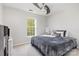 Bright bedroom with neutral walls and a ceiling fan at 815 Clearbrook Rd, Matthews, NC 28105