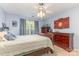 Cozy bedroom featuring a ceiling fan and two dark wood dressers at 815 Clearbrook Rd, Matthews, NC 28105