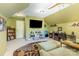 A bonus room with an accent rug, with shelves and entertainment center at 815 Clearbrook Rd, Matthews, NC 28105