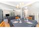 Open dining area, perfect for entertaining, blends seamlessly into the living room with plenty of natural light at 815 Clearbrook Rd, Matthews, NC 28105