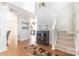 Bright entryway with high ceilings, hardwood floors, stairs and seamless transition to other rooms of the home at 815 Clearbrook Rd, Matthews, NC 28105