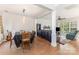 Open-concept living and dining area with hardwood floors, and a seamless transition to the adjacent space at 815 Clearbrook Rd, Matthews, NC 28105