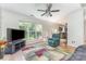 Living room with hard wood floors, ceiling fan and lots of natural light at 815 Clearbrook Rd, Matthews, NC 28105