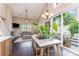 Bright dining area with modern table and chairs, and sliding glass doors to patio at 8734 Meadowmont View Dr, Charlotte, NC 28269
